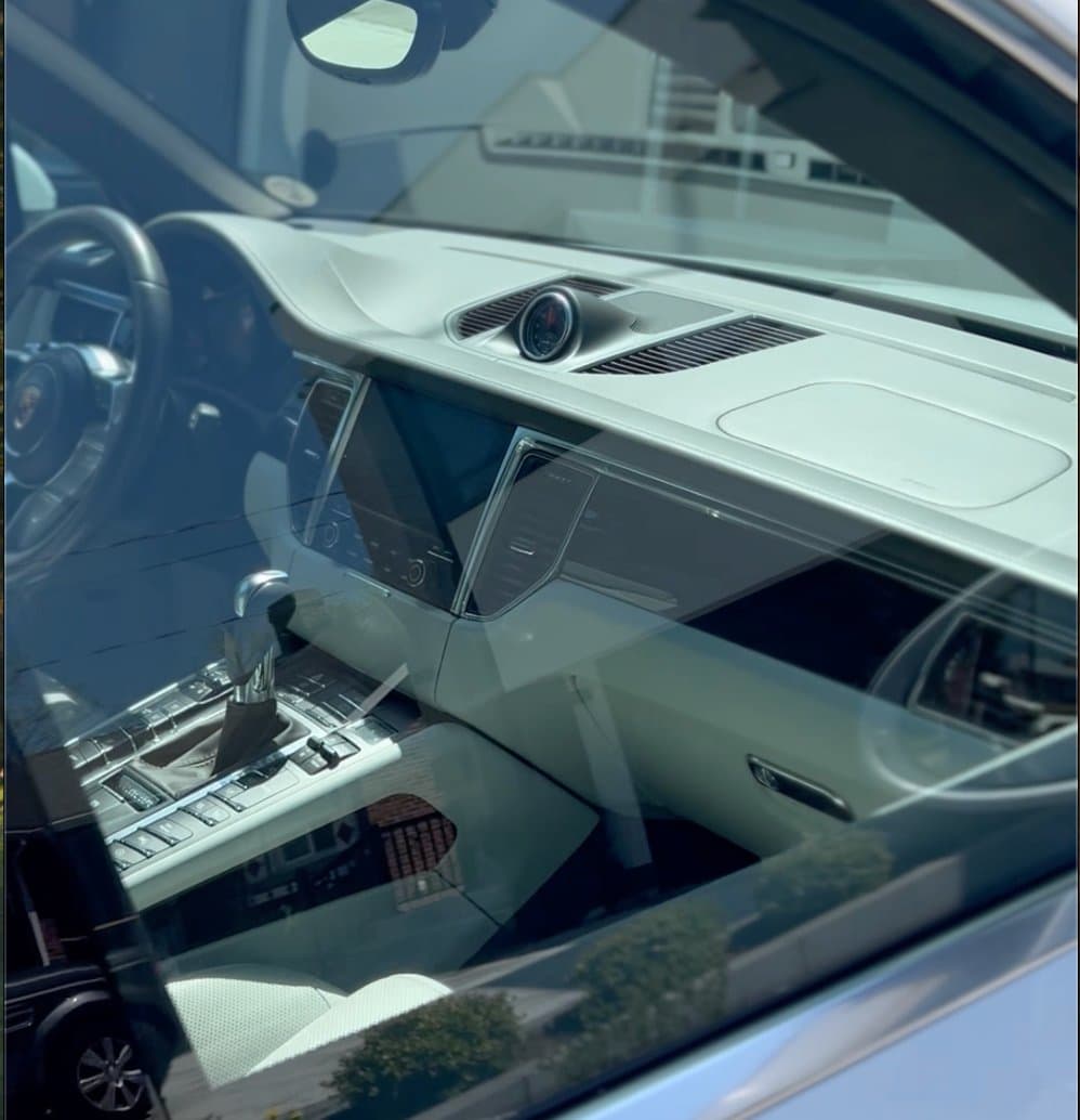 Luxury vehicle dashboard through window