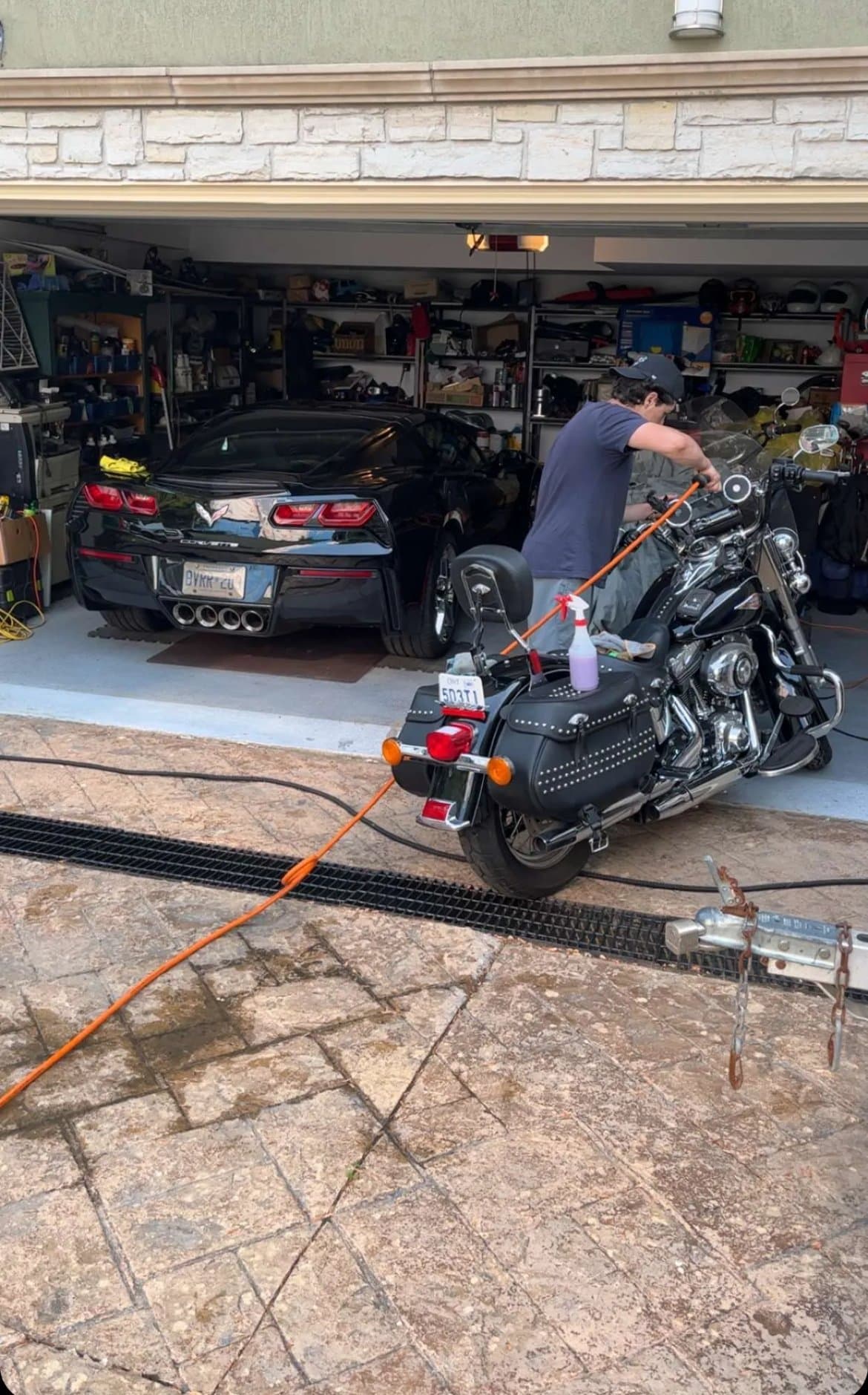 Detailing Corvette and motorcycle in garage