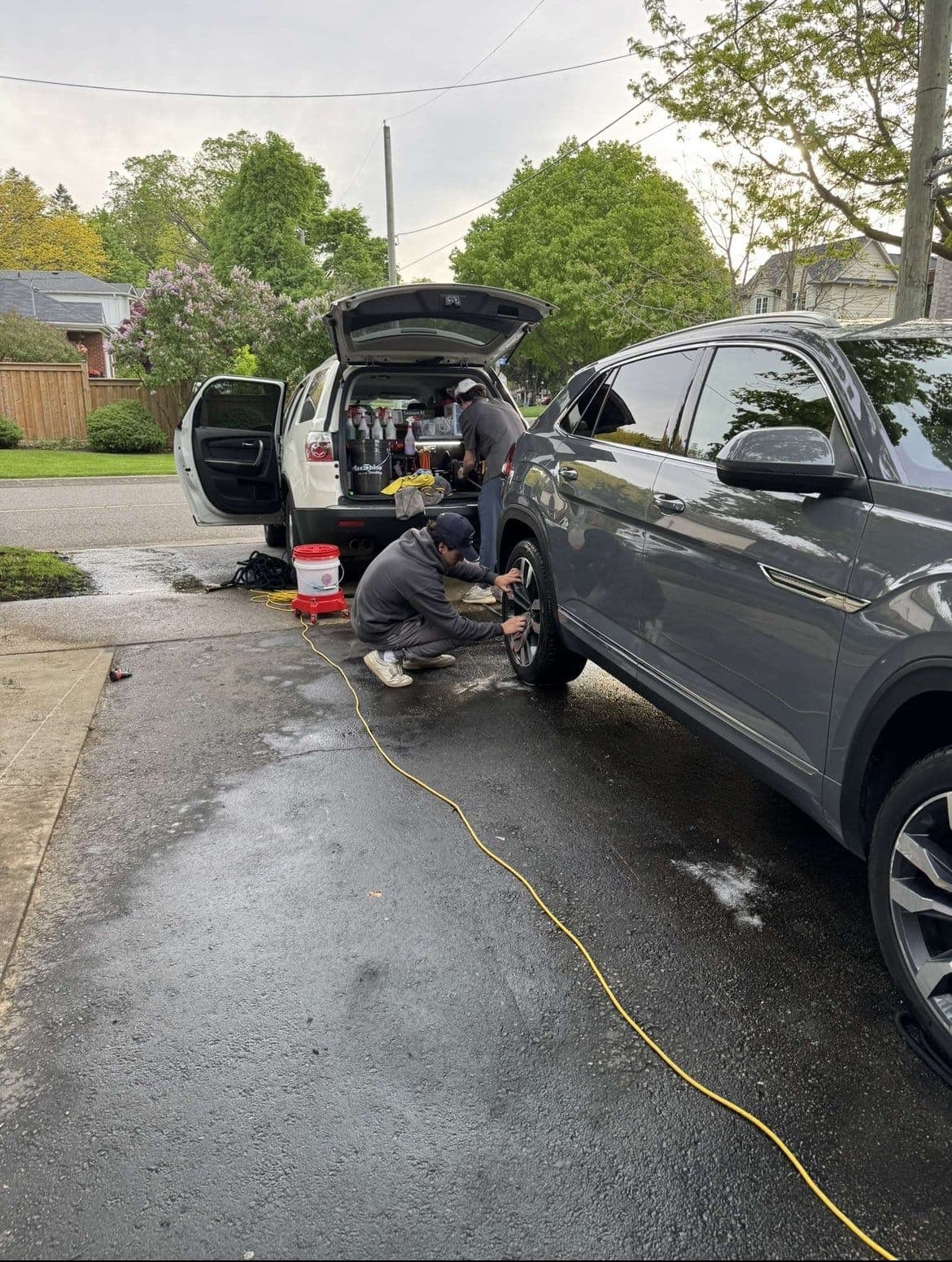 Team mobile detailing on driveway, exterior car detailing by GTA Luxury Detailing Toronto