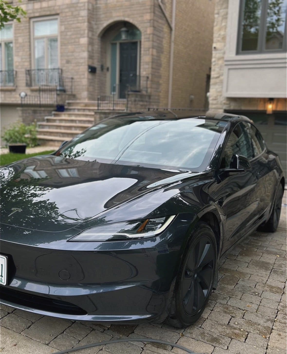 Tesla Model 3 with mirror-gloss paint reflections after a Gold Exterior detail
